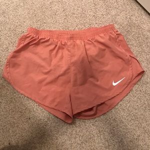 Peach Nike running shorts